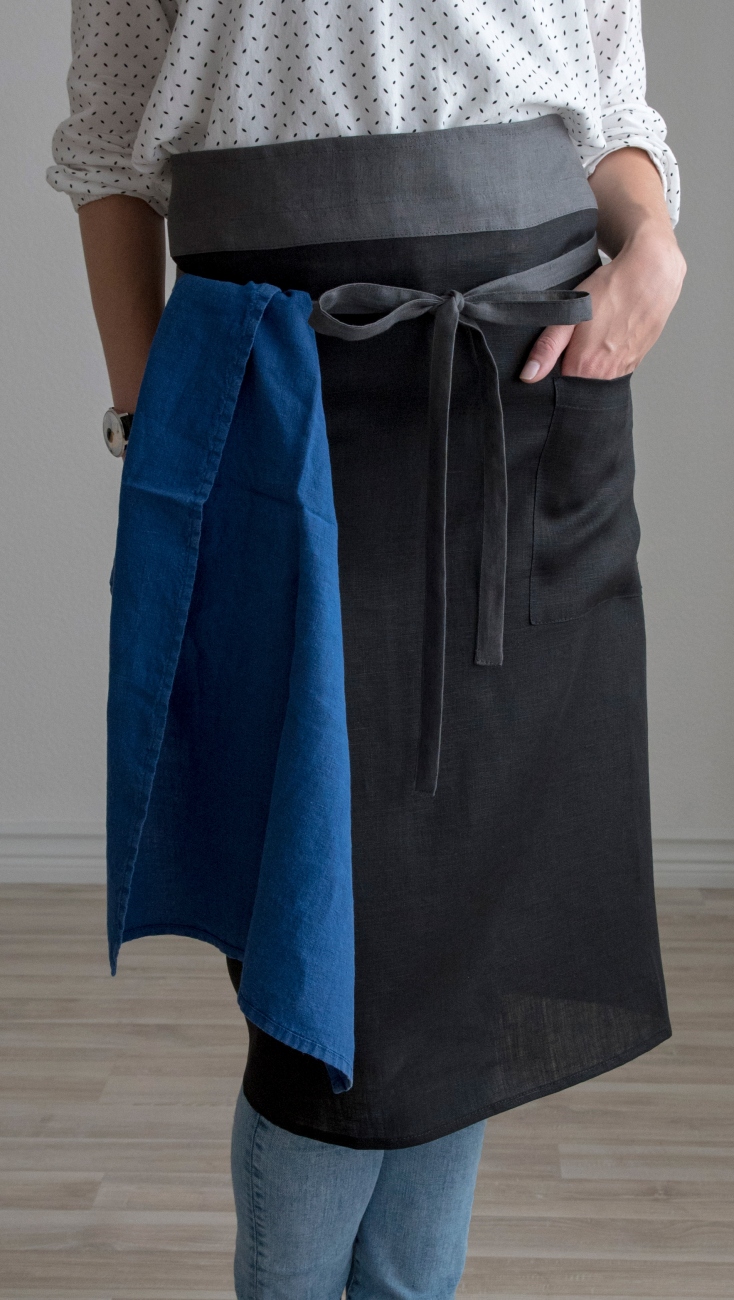 Black linen half apron with a pocket
