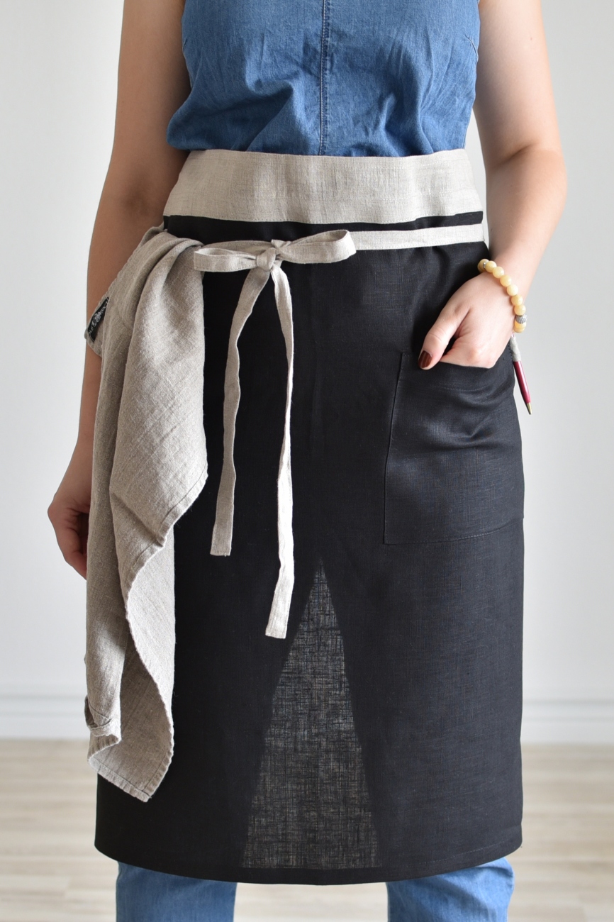 Black linen half apron with a pocket