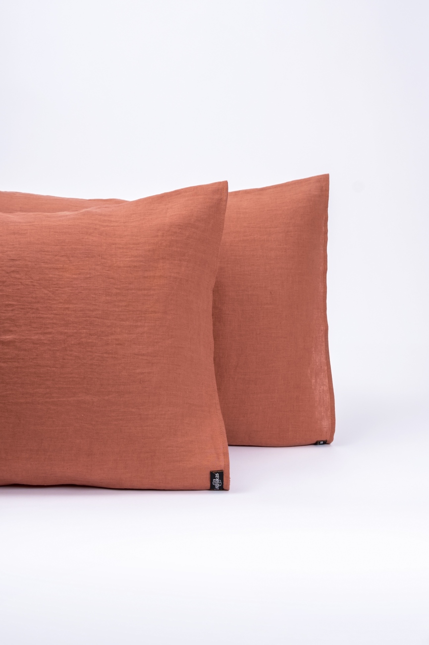 Burnt orange washed linen pillowcase with an envelope closure