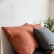 Burnt orange washed linen pillowcase with an envelope closure