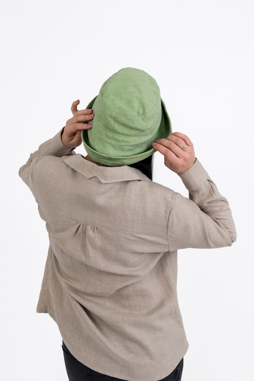 Green bucket hat with stitching