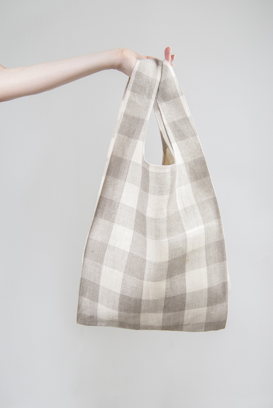 Linen knot bag with buffalo check pattern