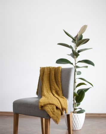 Mustard linen throw blanket with frayed ends