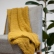 Mustard linen throw blanket with simple hem