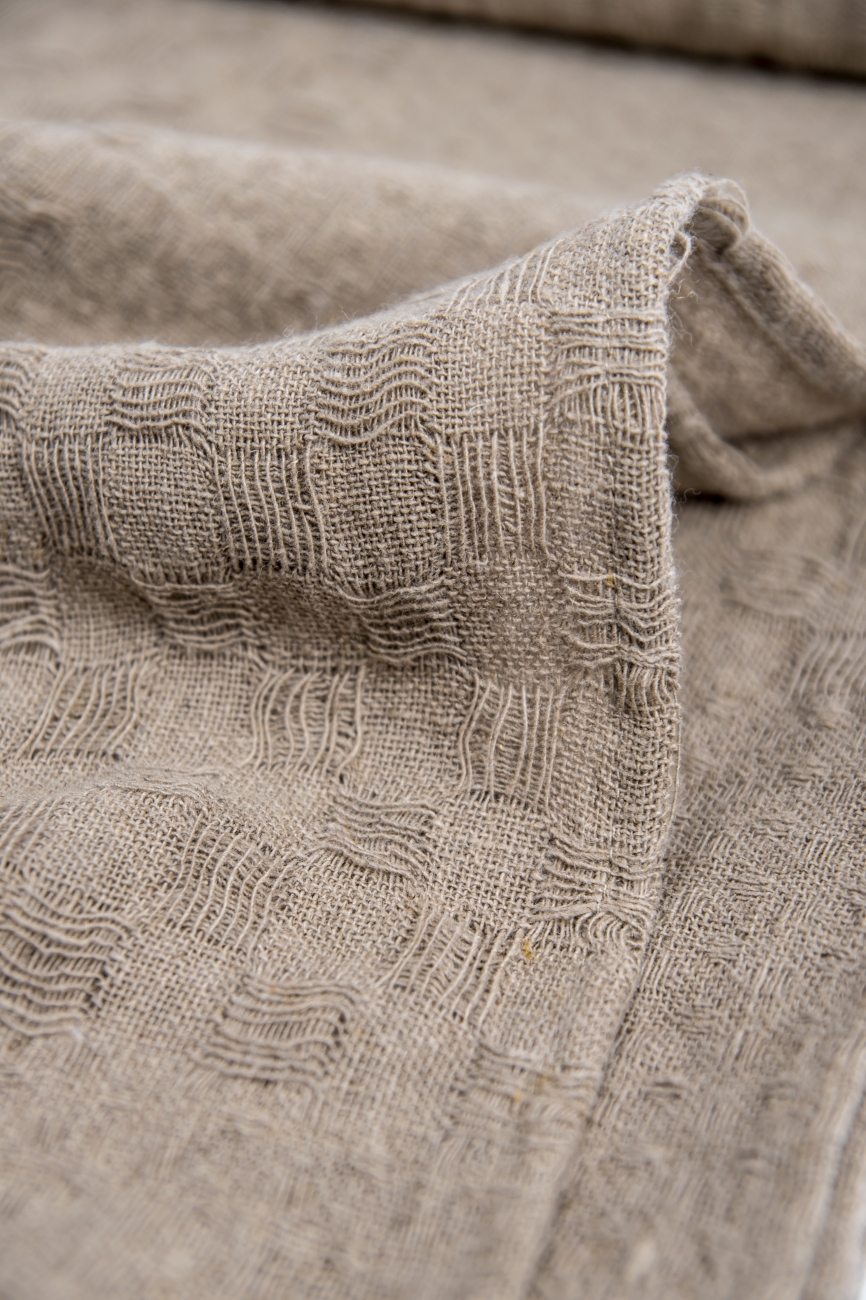 Natural linen throw blanket with simple hem