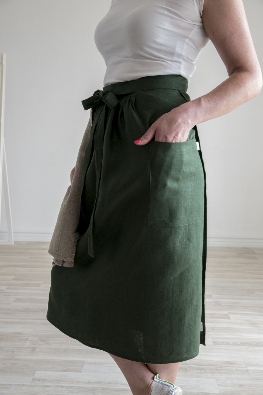 Purple washed linen half apron with adjustable width and a pocket