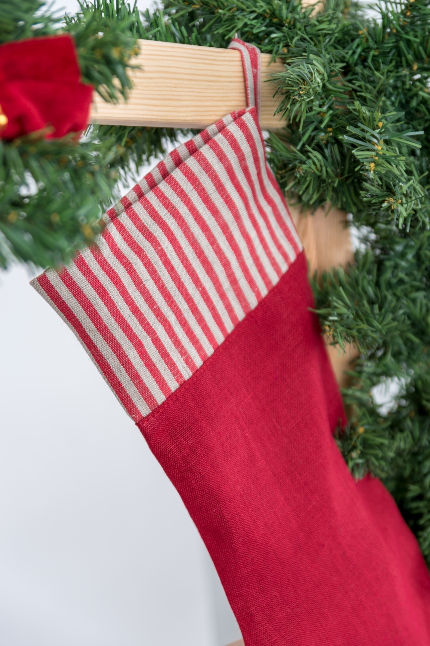 Red Christmas stocking with striped cuff