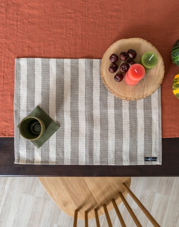 Set of beige linen table placemats with narrow stripes
