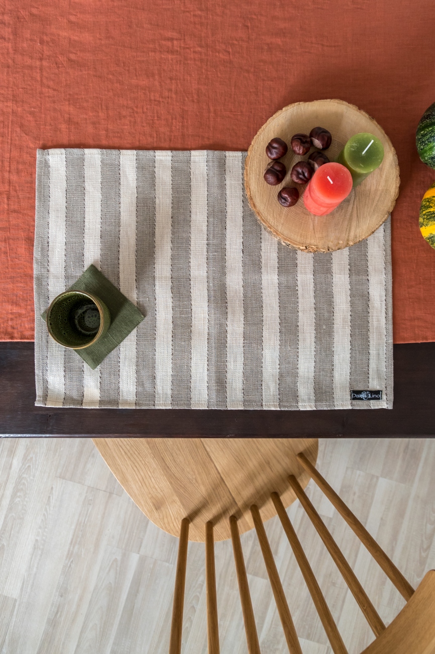 Set of beige linen table placemats with narrow stripes