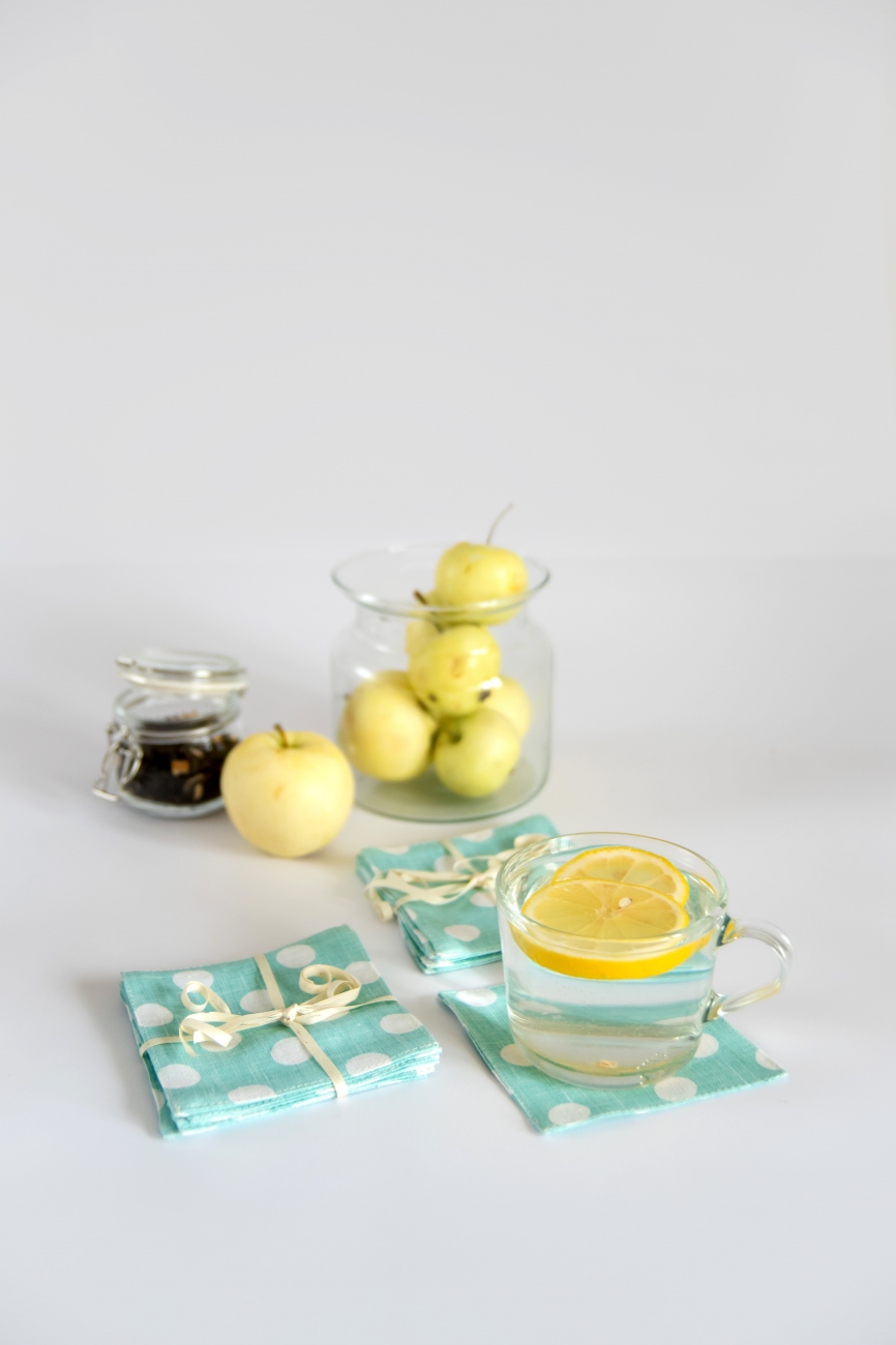 Set of mint linen coasters with polka dot pattern