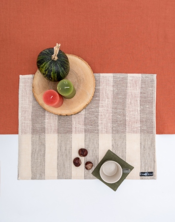 Set of striped linen table placemats in beige