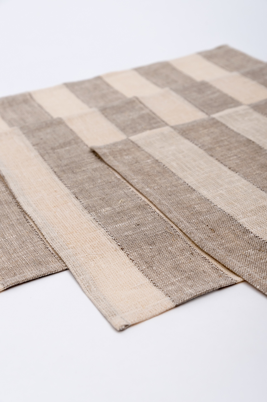 Set of striped linen table placemats in beige