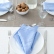 Set of washed linen napkins in cornflower blue