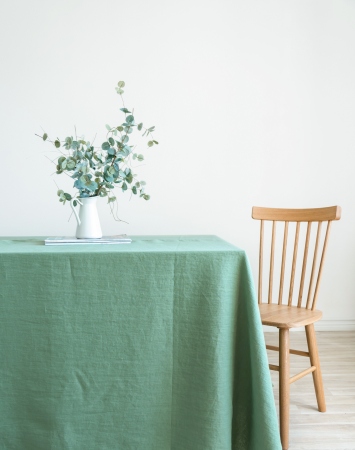 Washed linen tablecloth in basil green