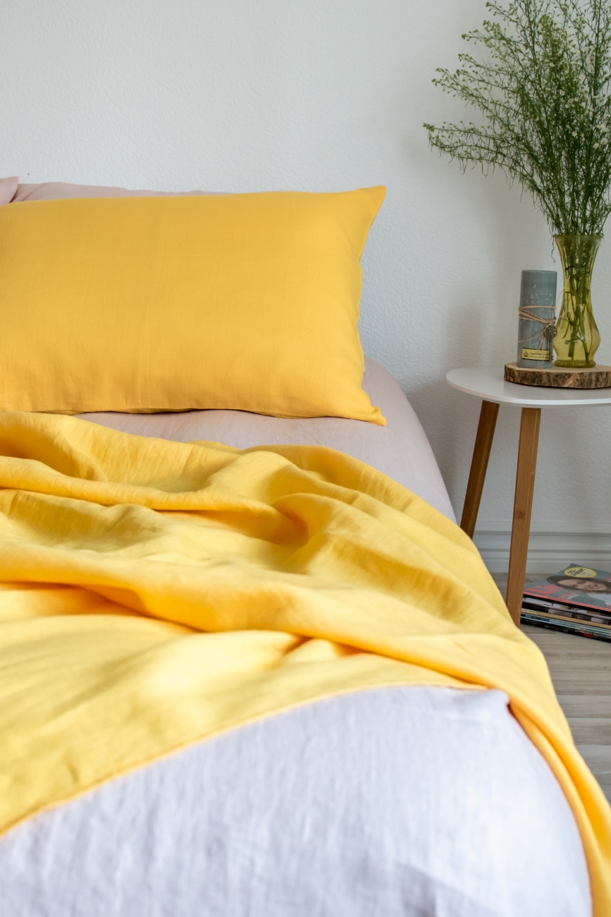 Yellow washed linen pillowcase with an envelope closure