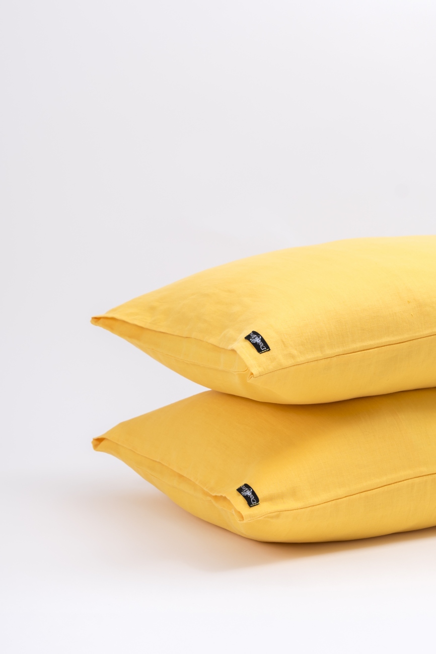 Yellow washed linen pillowcase with an envelope closure