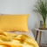 Yellow washed linen pillowcase with an envelope closure