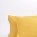 Yellow washed linen pillowcase with an envelope closure
